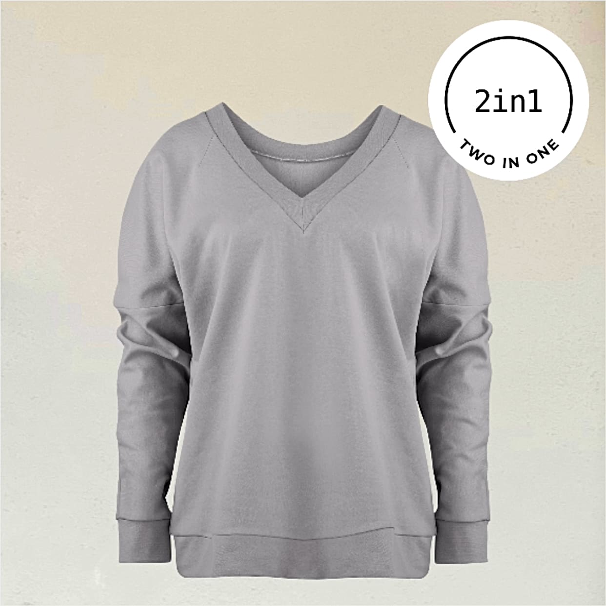 Graues Sweatshirt mit V-Ausschnitt vor beigem Hintergrund mit weißem, rundem 2IN1-Icon