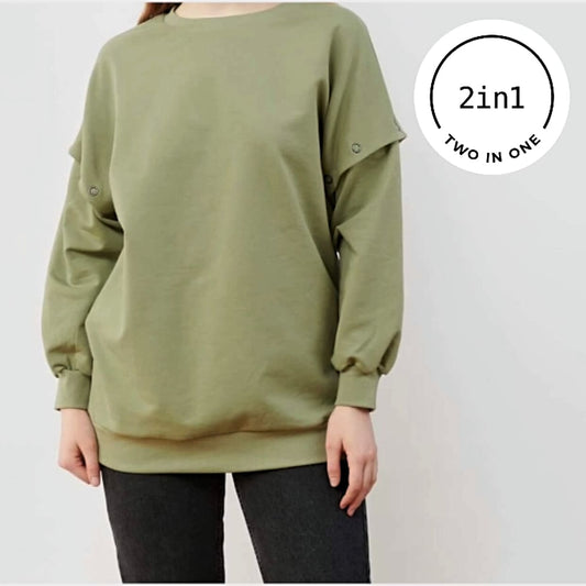 Sagefarbenes Sweatshirt mit abnehmbaren Ärmeln an Frauenkörper mit weißem, rundem 2IN1-Icon